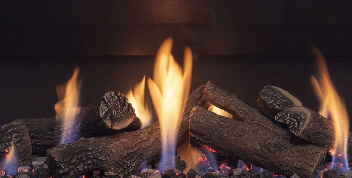 Flames rising through ceramic logs